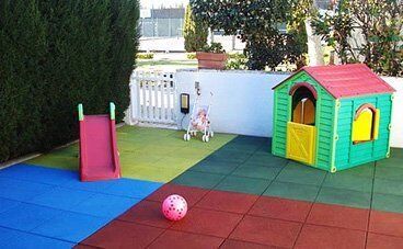 Outdoor soft flooring with rubber.